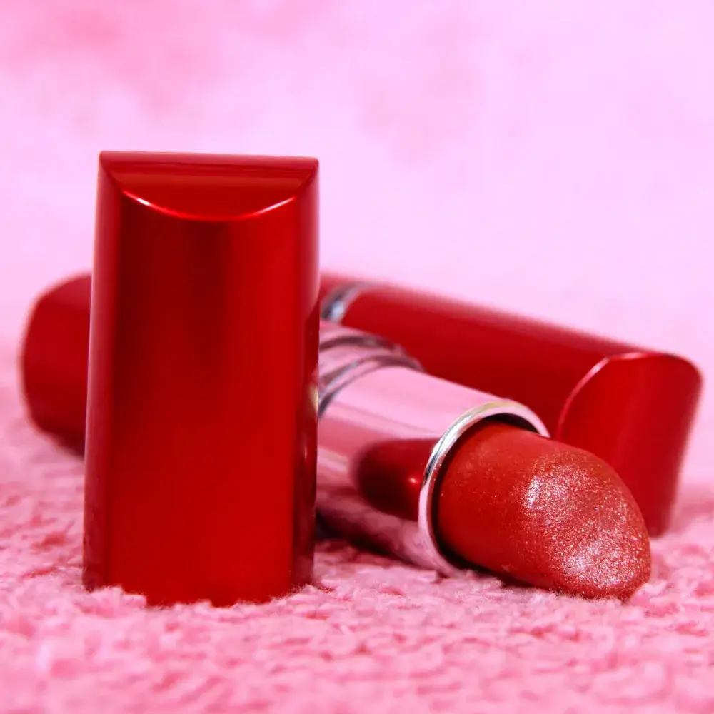 red lipstick on a pink background