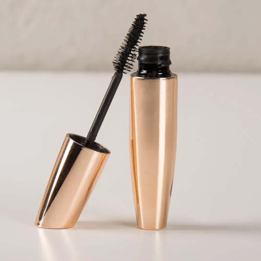 smudge proof mascara in gold-colored tube