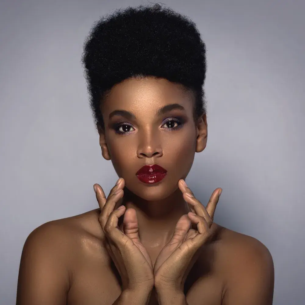 beautiful young african woman with red lips and makeup