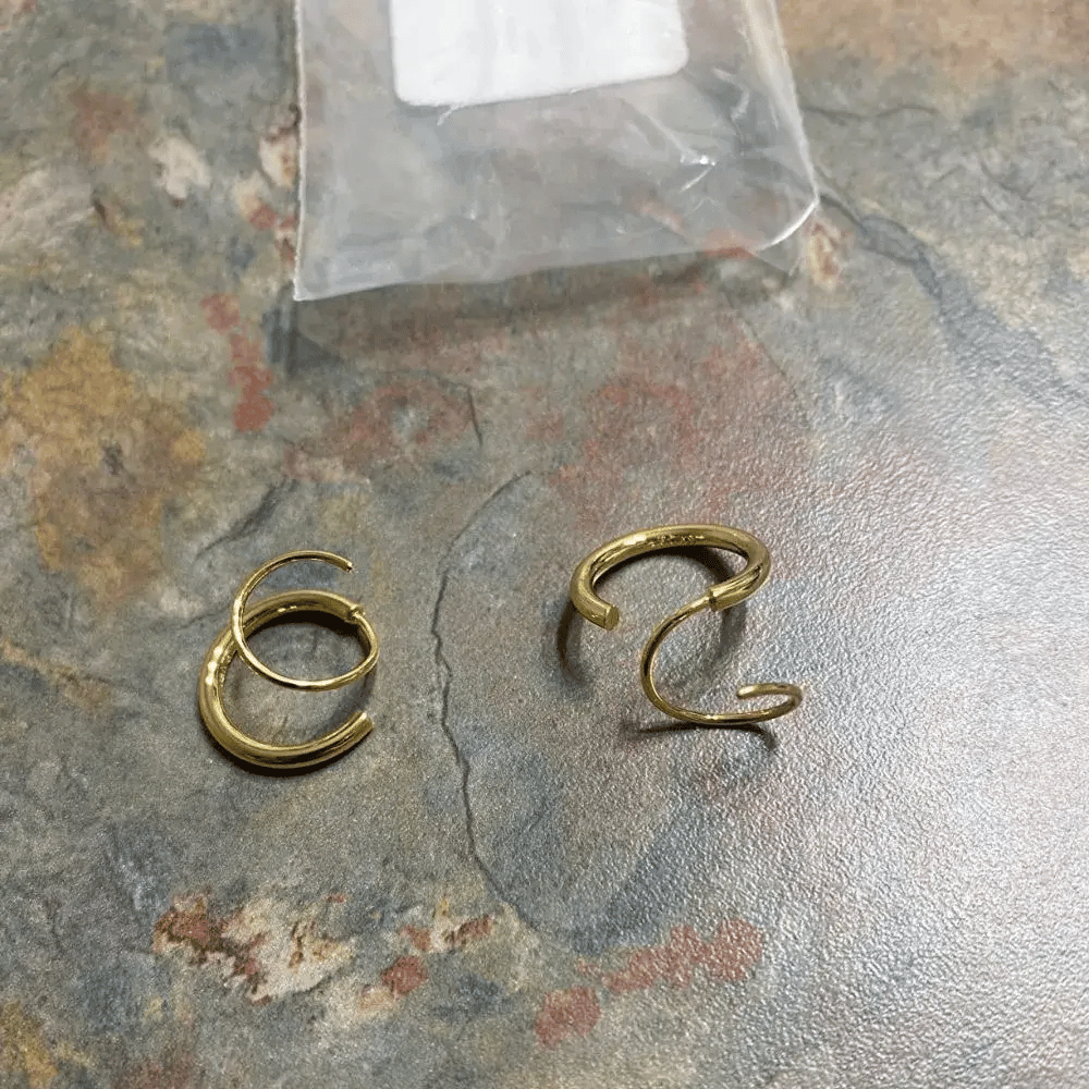 pair of gold twist earrings