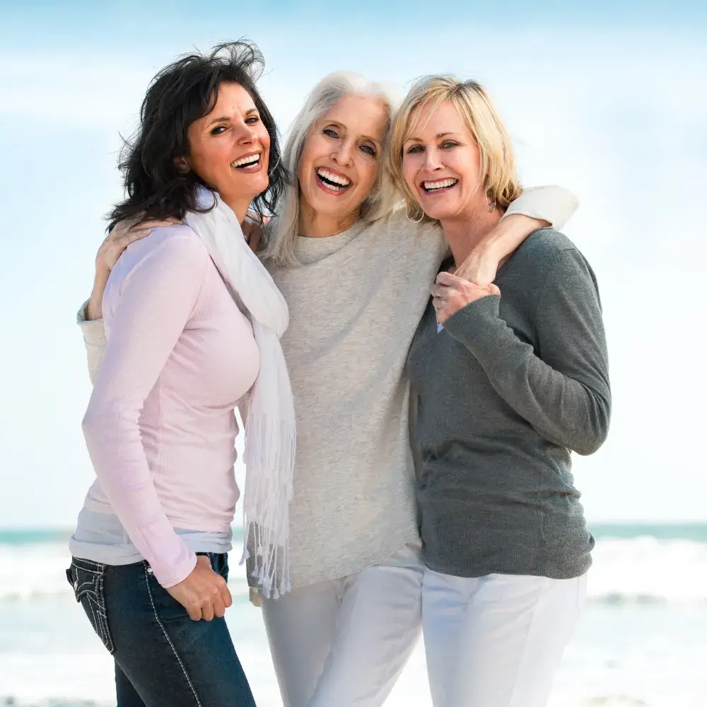 three older women smiling