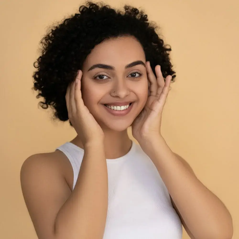 What is the best way to apply bronzer stick for a natural look?