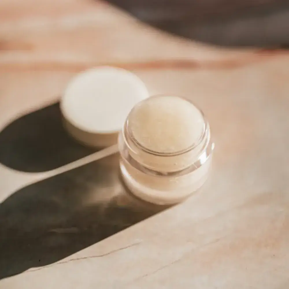 face moisturizer in a small glass container