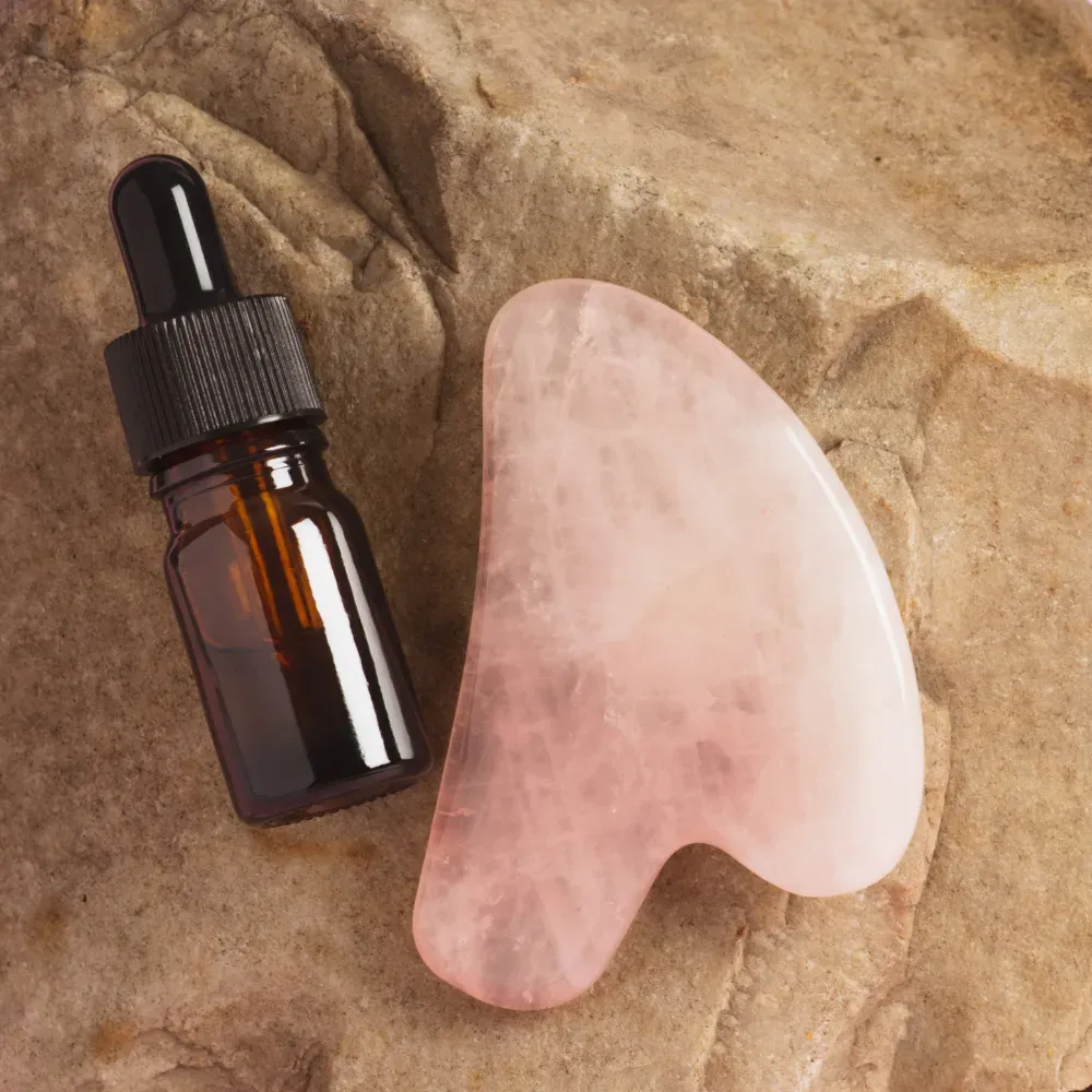 face oil and rose quarts gua sha