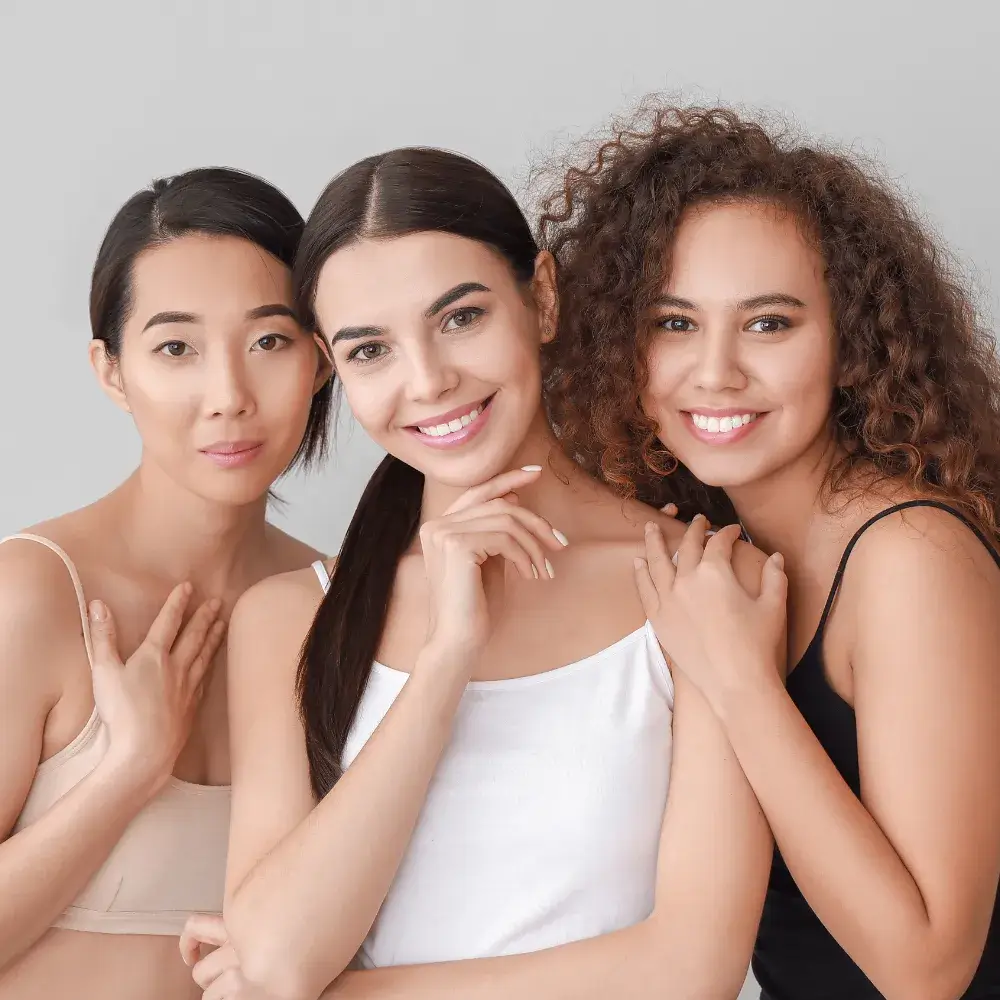 three diverse women posing
