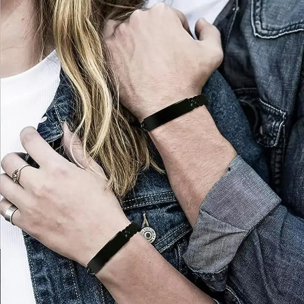 close up of couple's wrists with couple bracelets leather