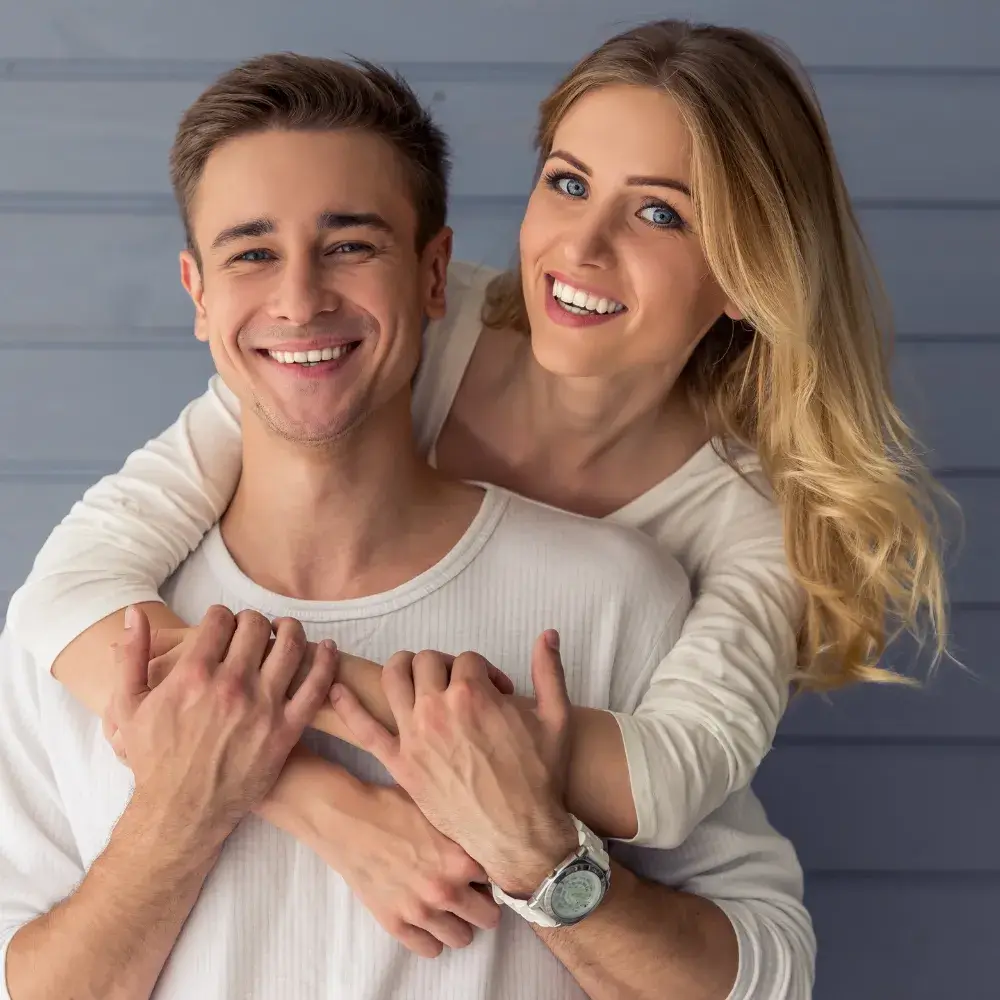 happy couple wearing white