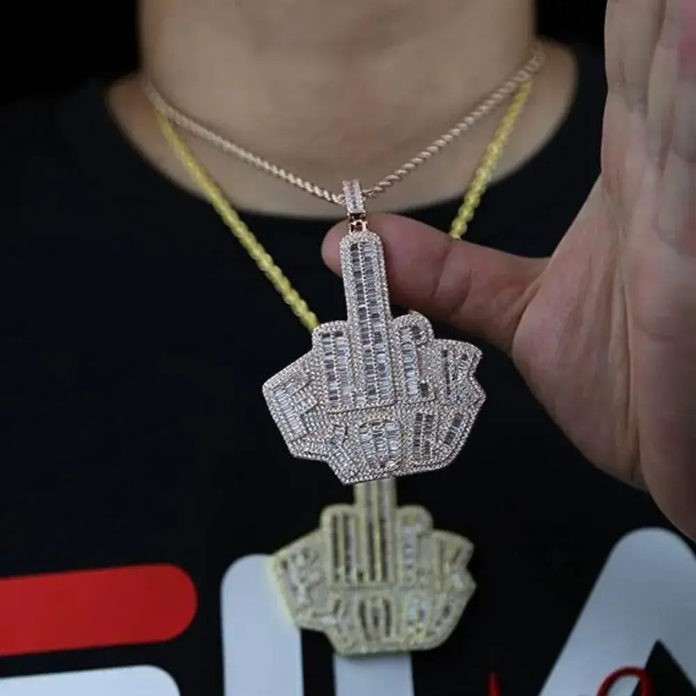 close up of a middle finger necklace on a man's neck