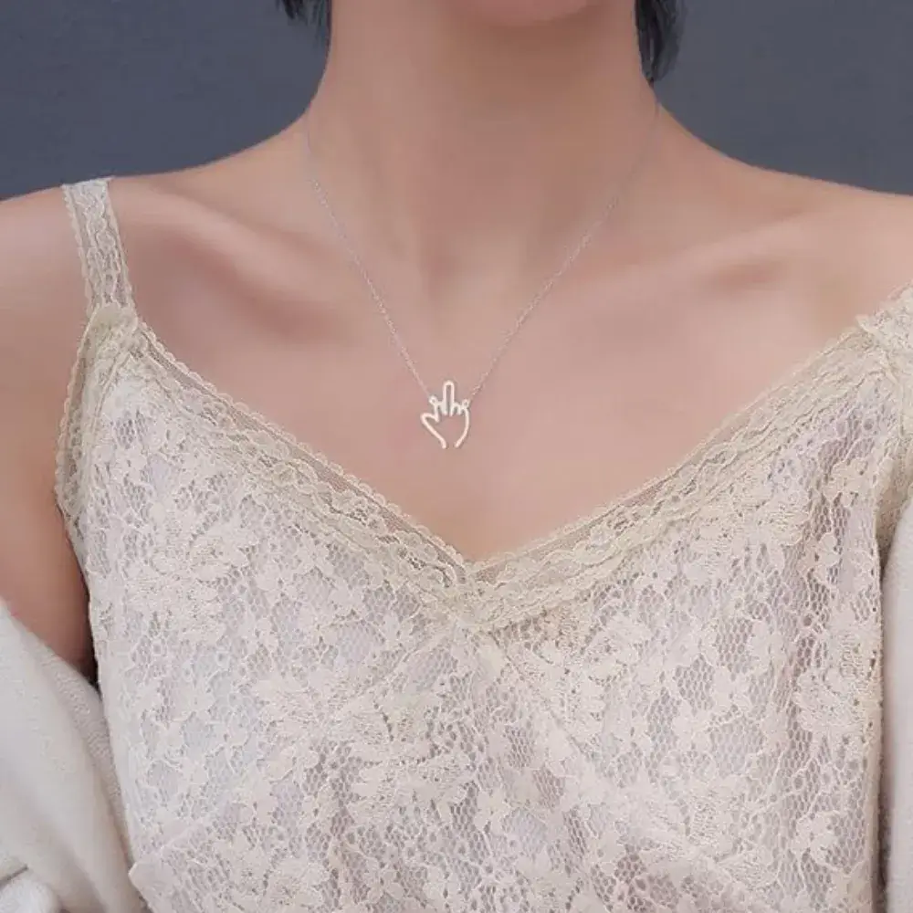 young woman's neckl with silver middle finger necklace