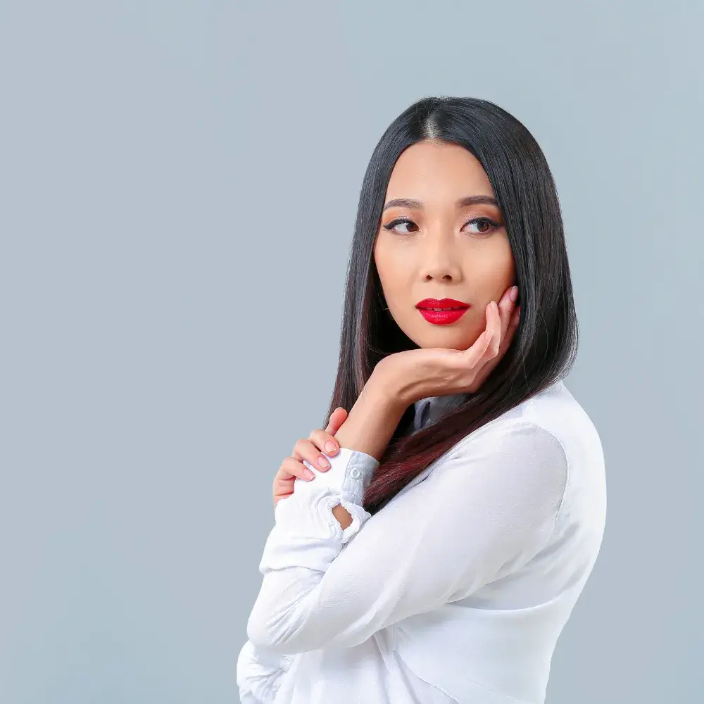 asian woman with black straight hair wearing red lipstick