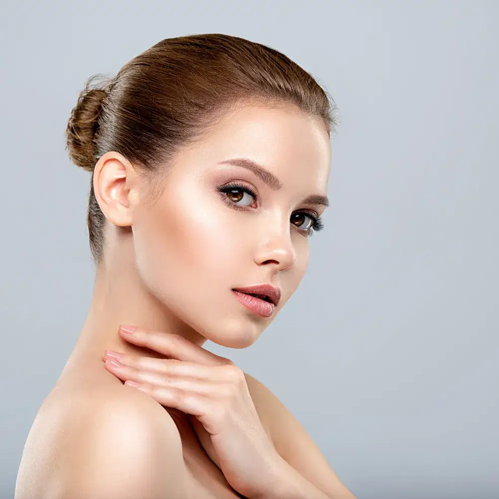 portrait side view of a young woman with flawless and clear skin