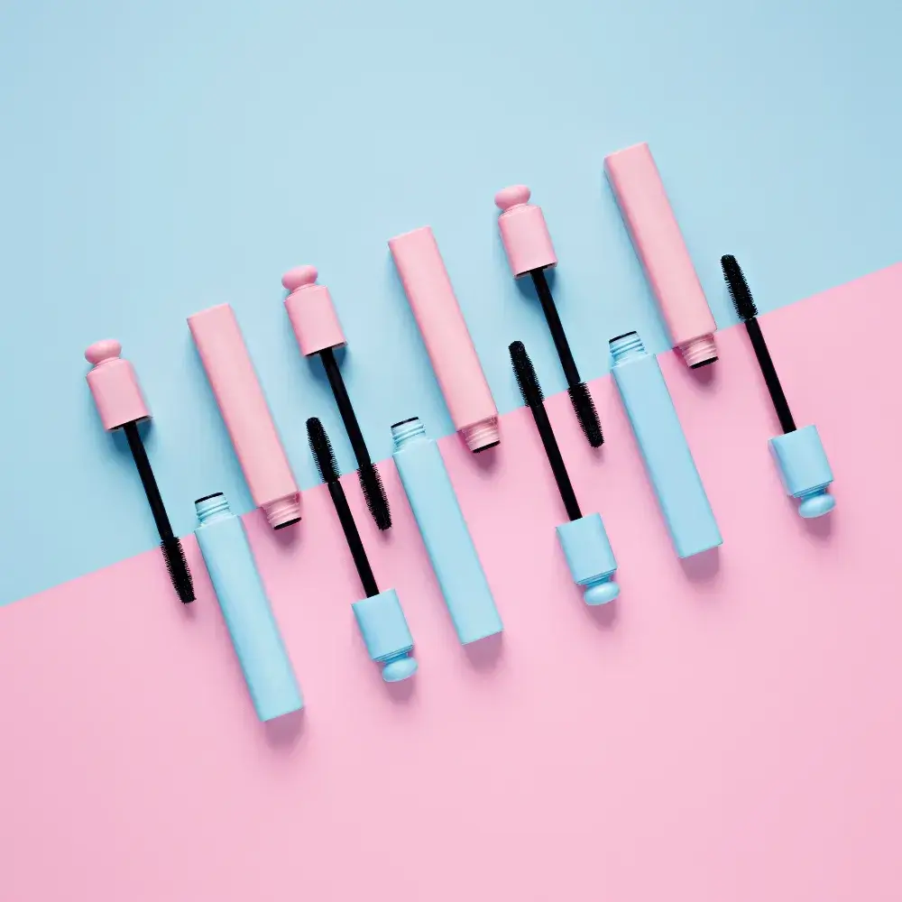 blue and pink mascaras with pink and blue background