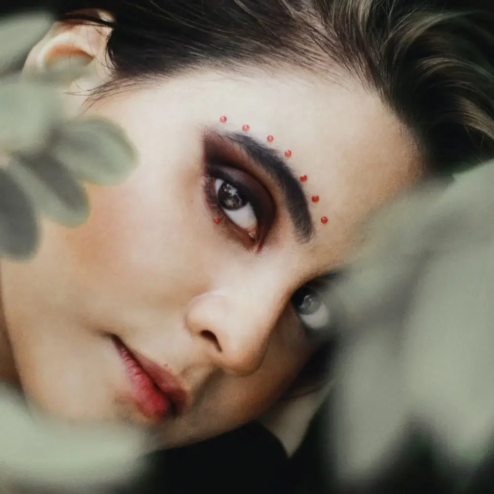 How can I make my eyes appear larger or smaller using eyeliner for sensitive eyes?