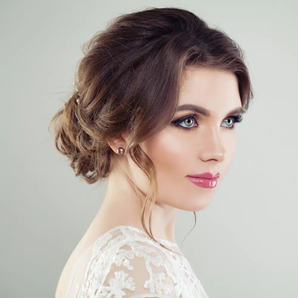 side view portrait of a beautiful woman with make up and elegant hairstyle