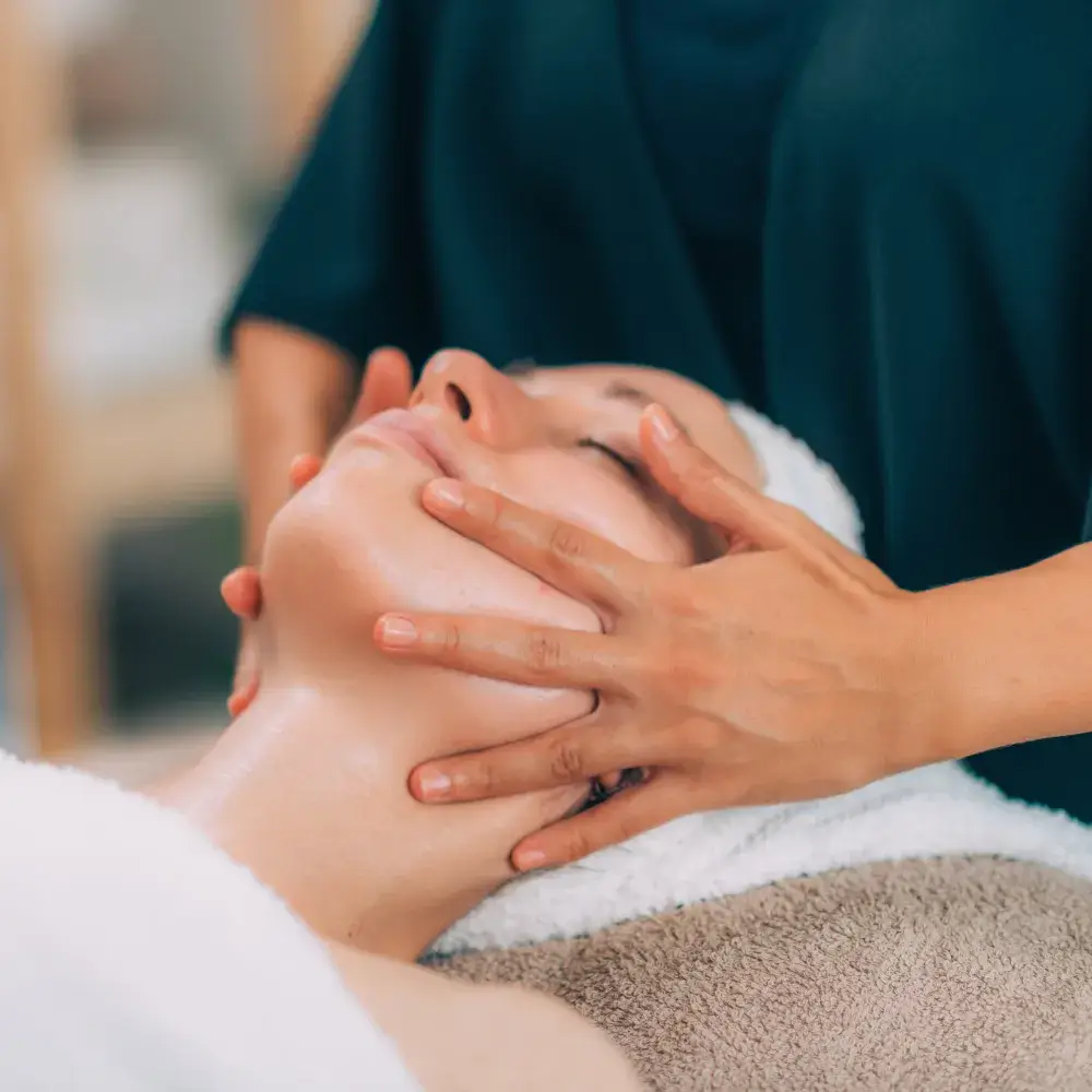 portrait of a woman getting a face massage