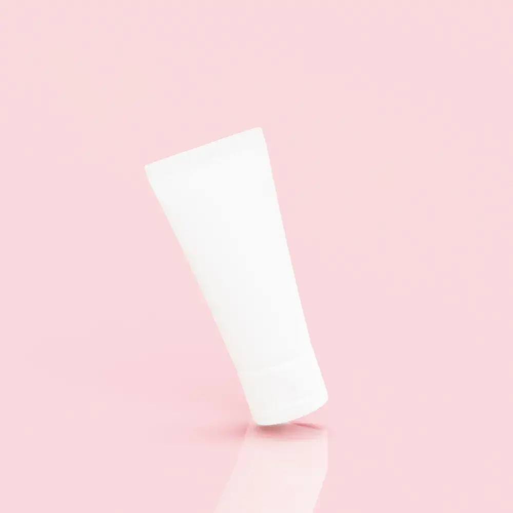 salicylic acid face wash tube against a light pink background