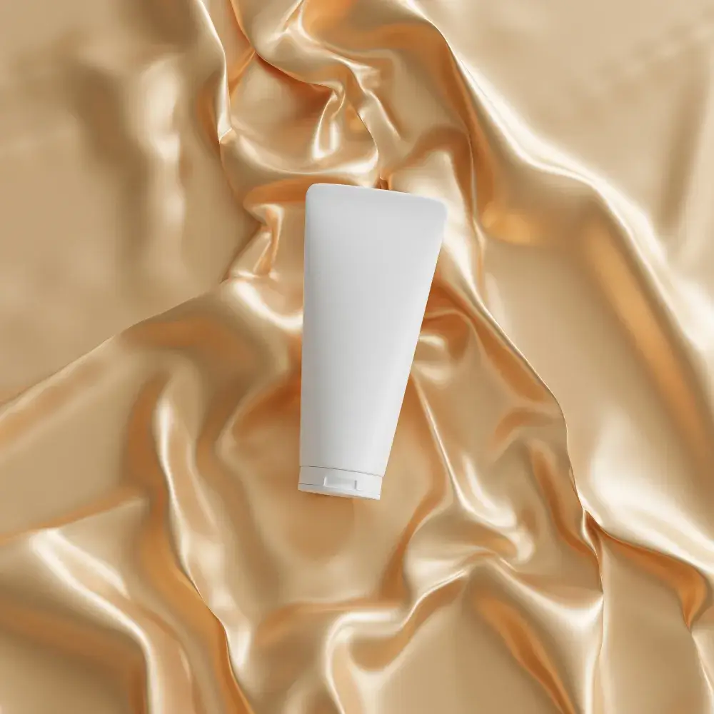 salicylic face wash tube placed on a golden satin cloth