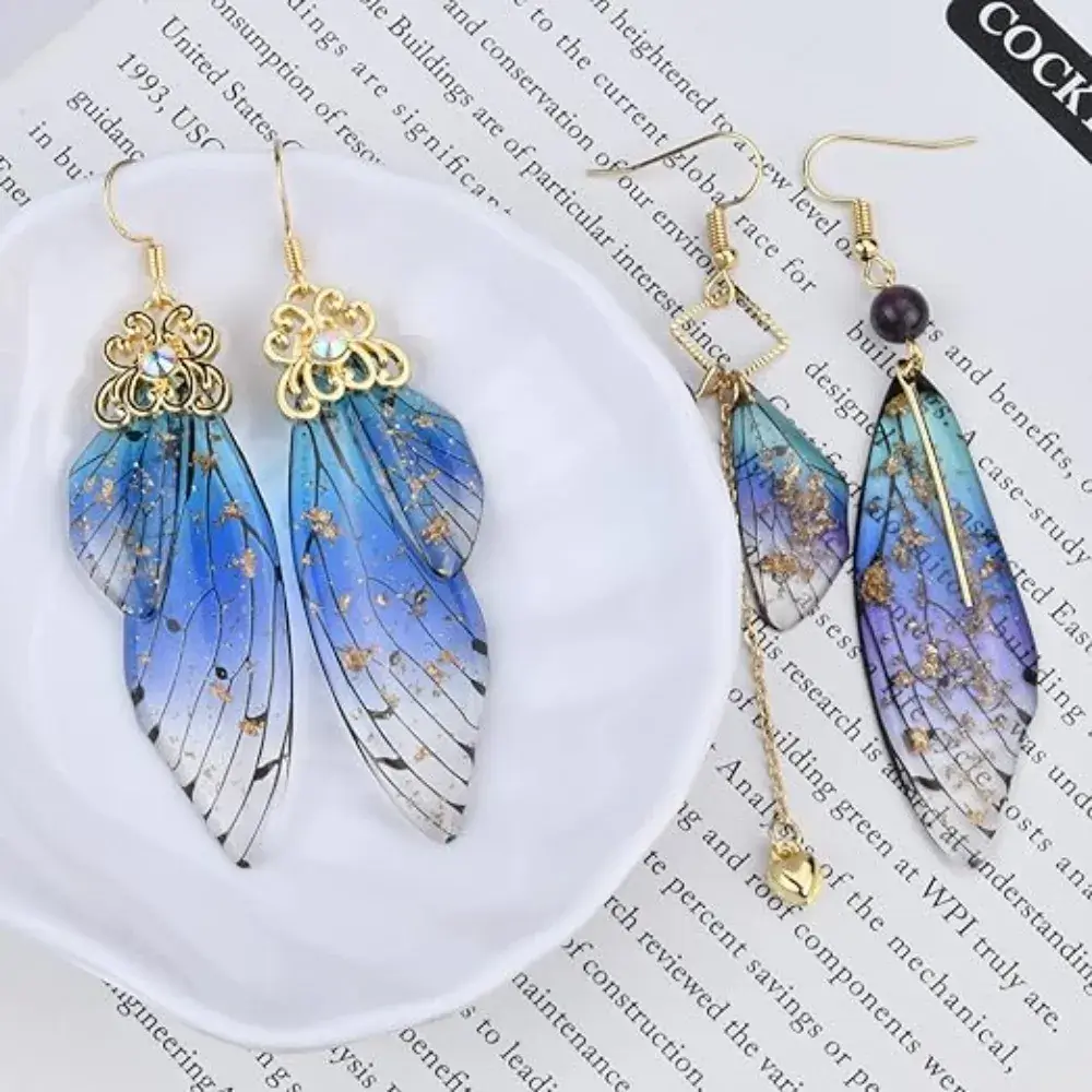 two pairs of blue butterfly wings earrings
