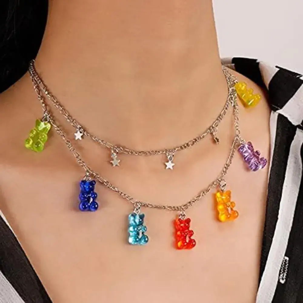 close-up of a woman's neck with a gummy bear necklace