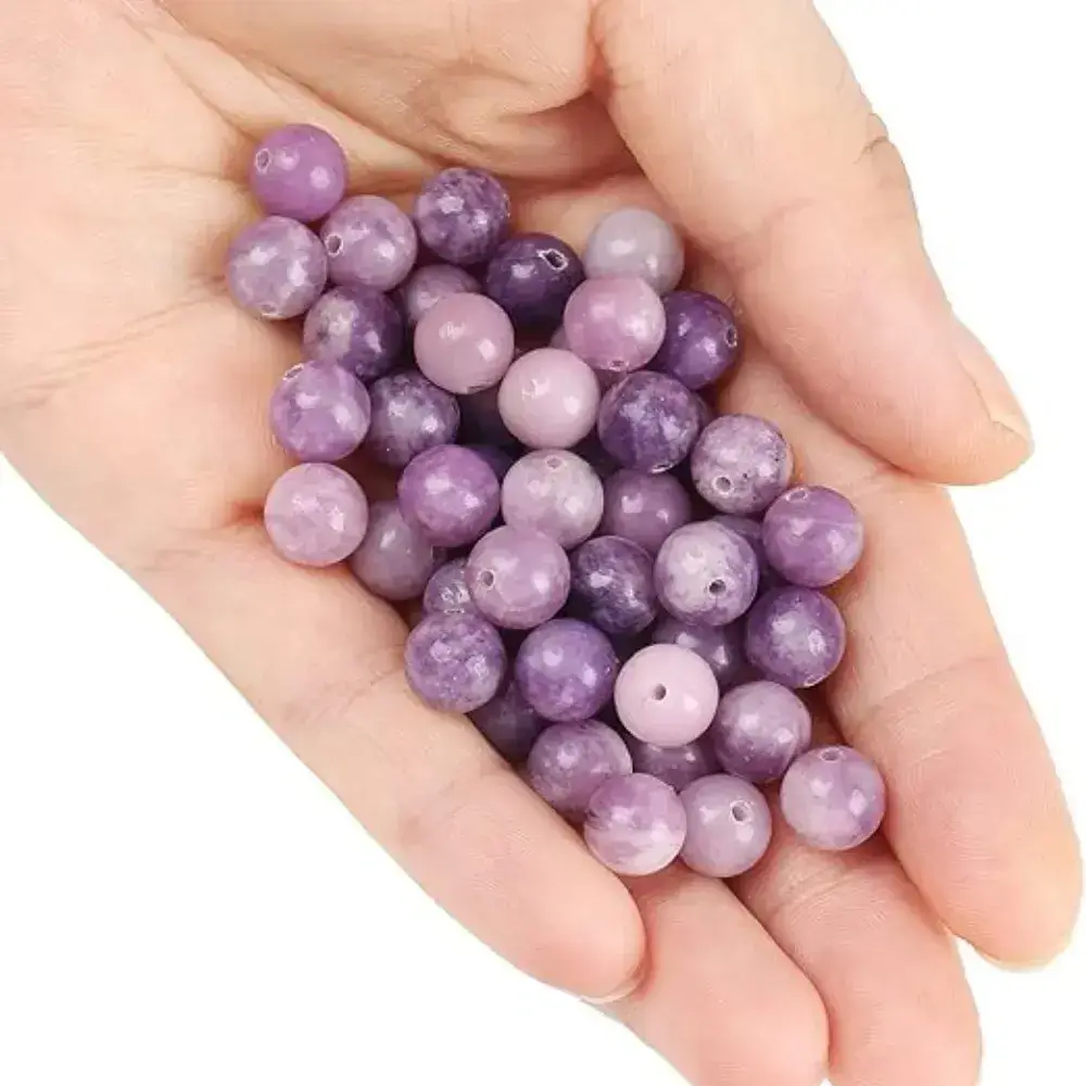 lepidolite beads on the palm