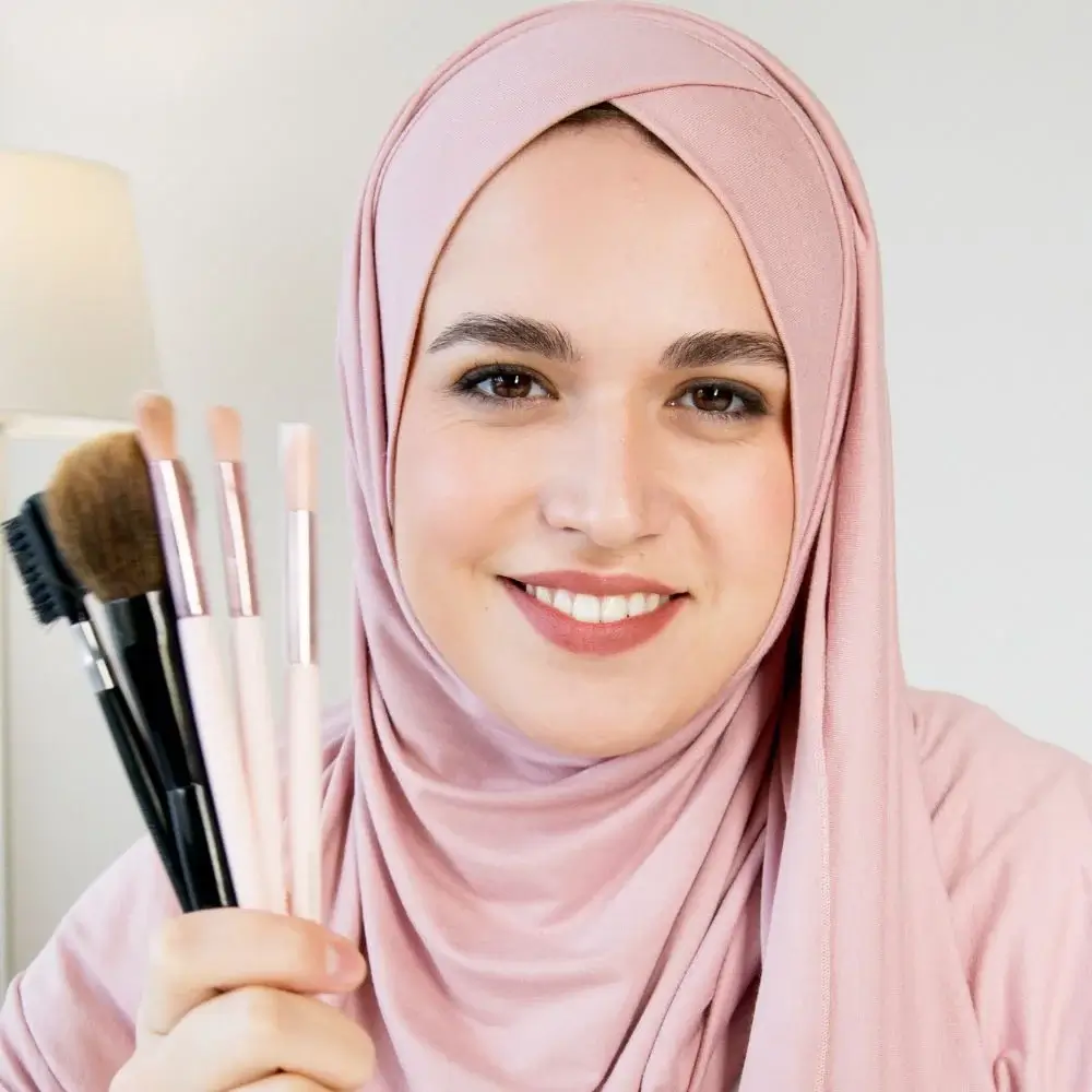 What are the benefits of using a makeup brush?