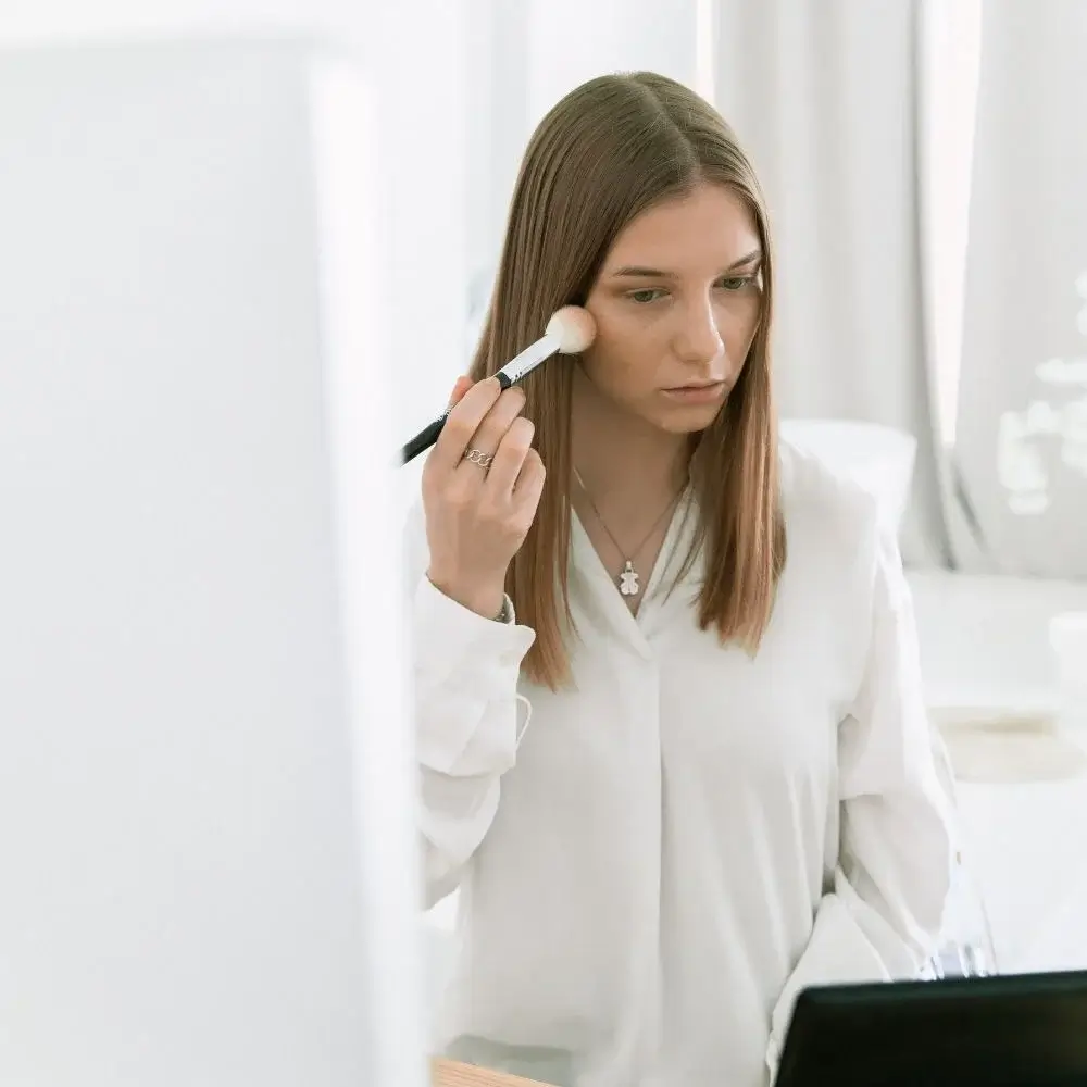 How do you use a makeup brush?