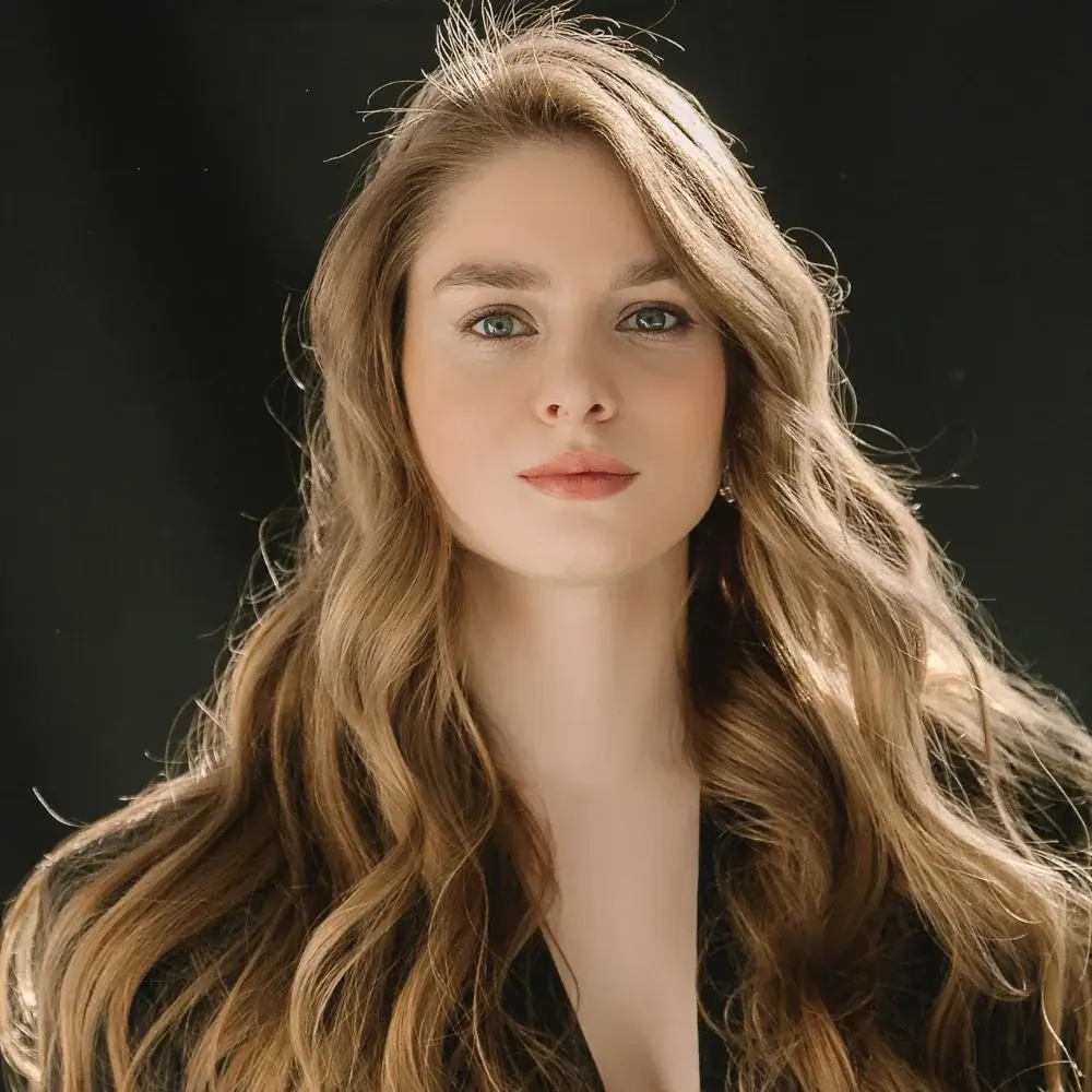 What should I do if my hair becomes stiff or sticky after using hair spray?