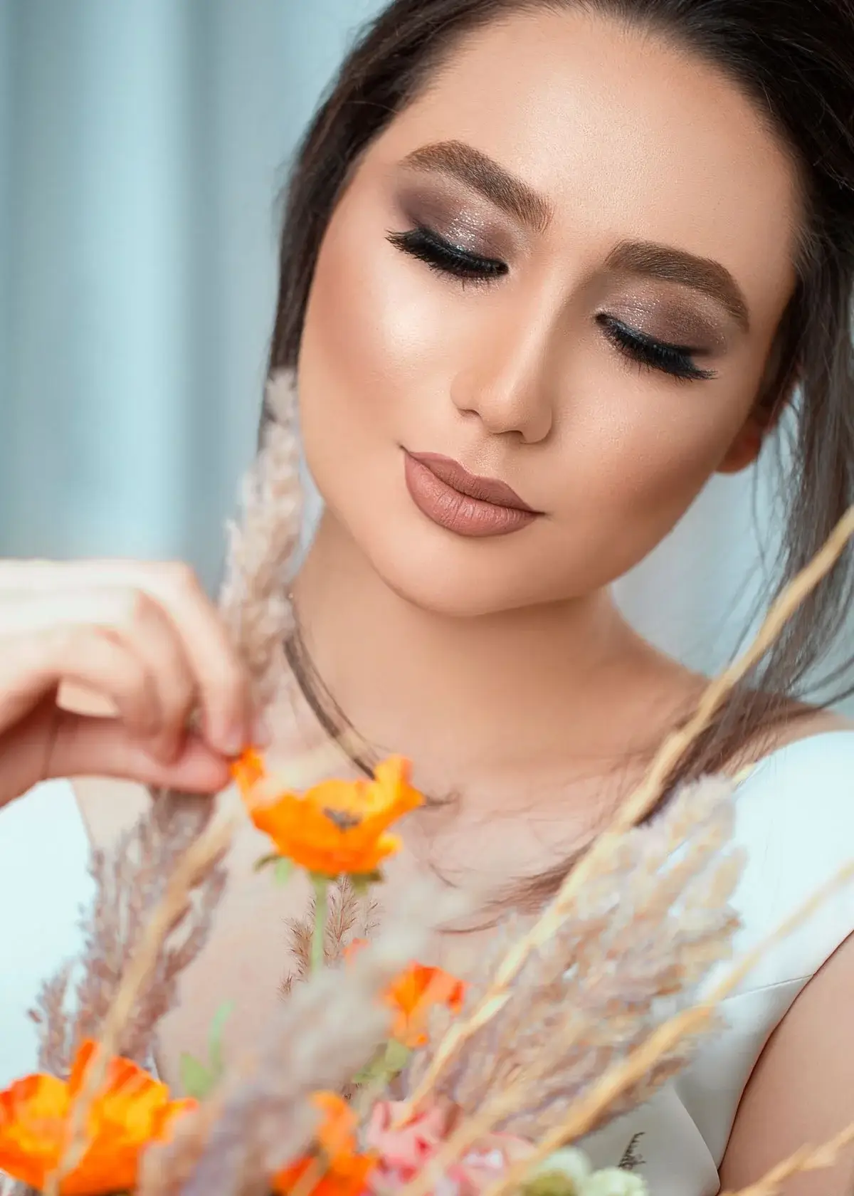 How do I apply eyeliner without damaging my eyelash extensions?