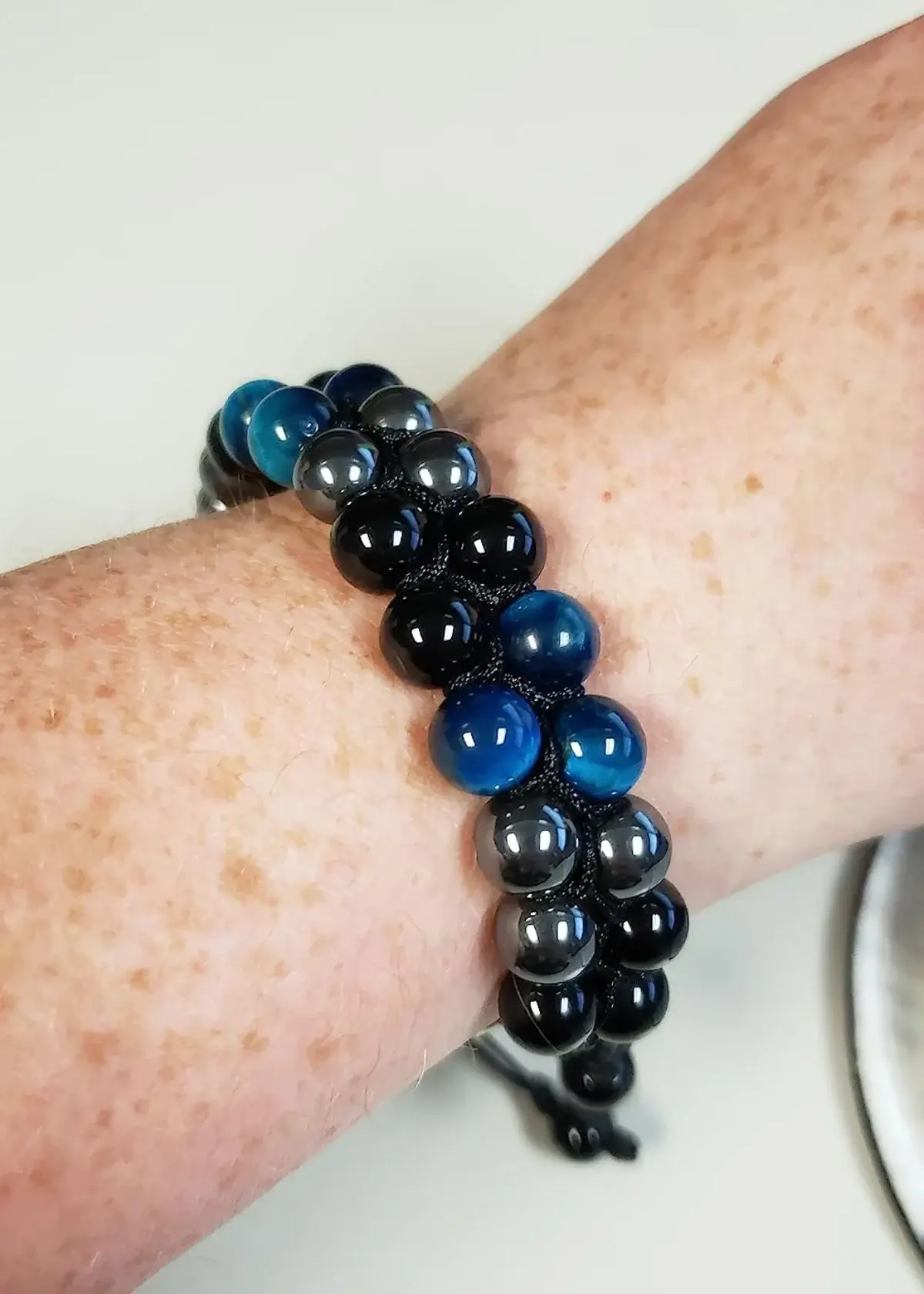 What are the benefits of wearing a Triple Protection Bracelet?
