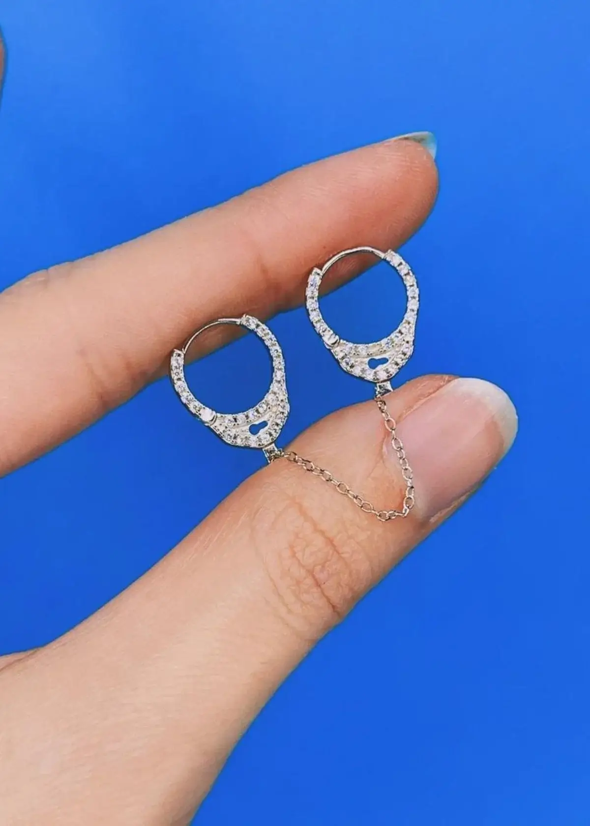 What materials are handcuff earrings made from?
