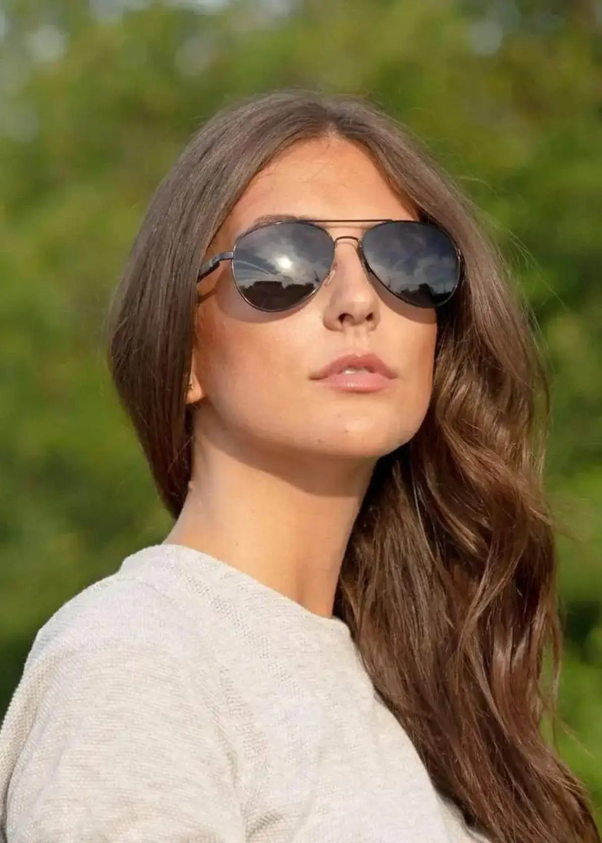Why do angular sunglasses work well for oval faces?