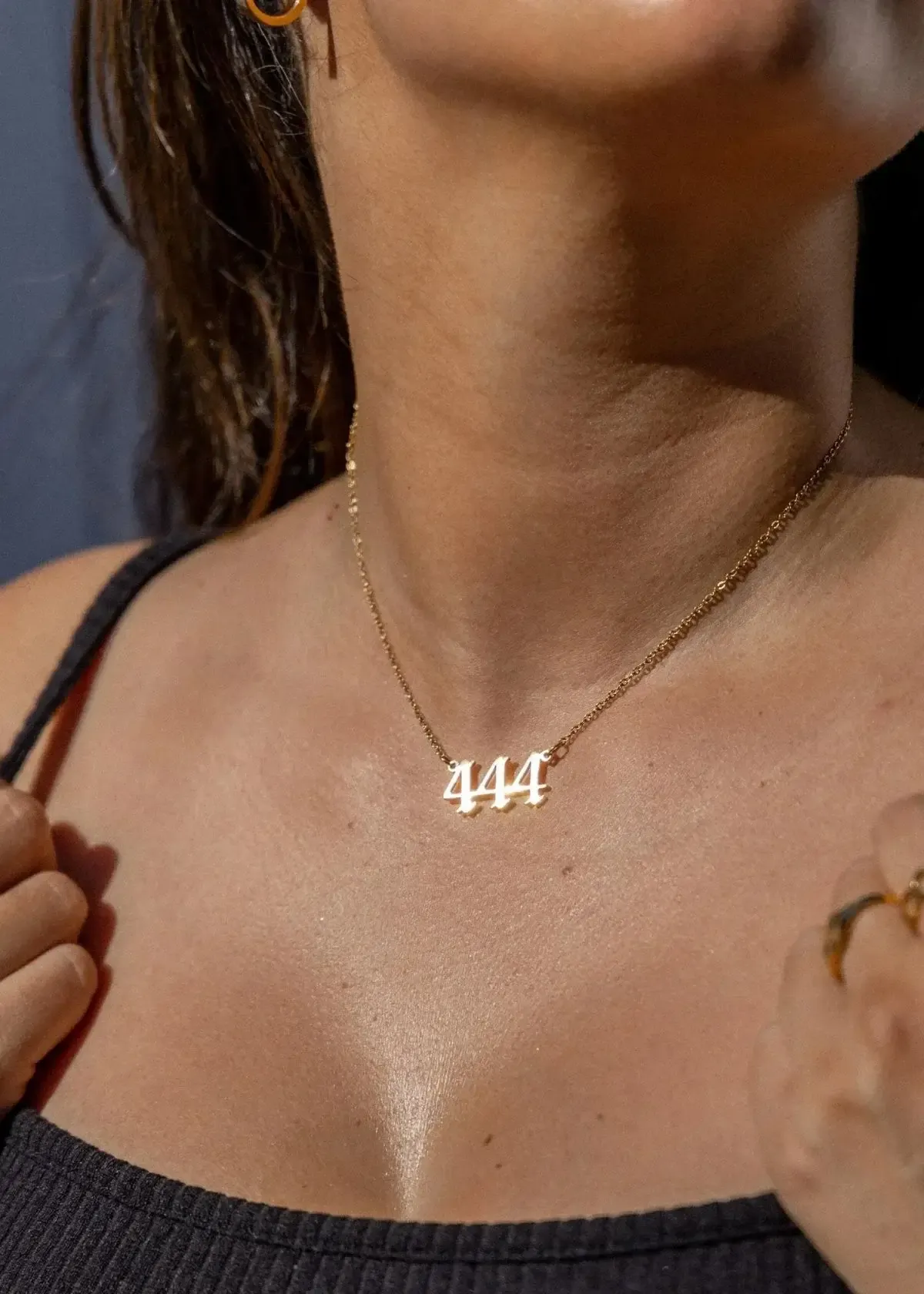 Can wearing a 444 necklace bring luck or positive energy?