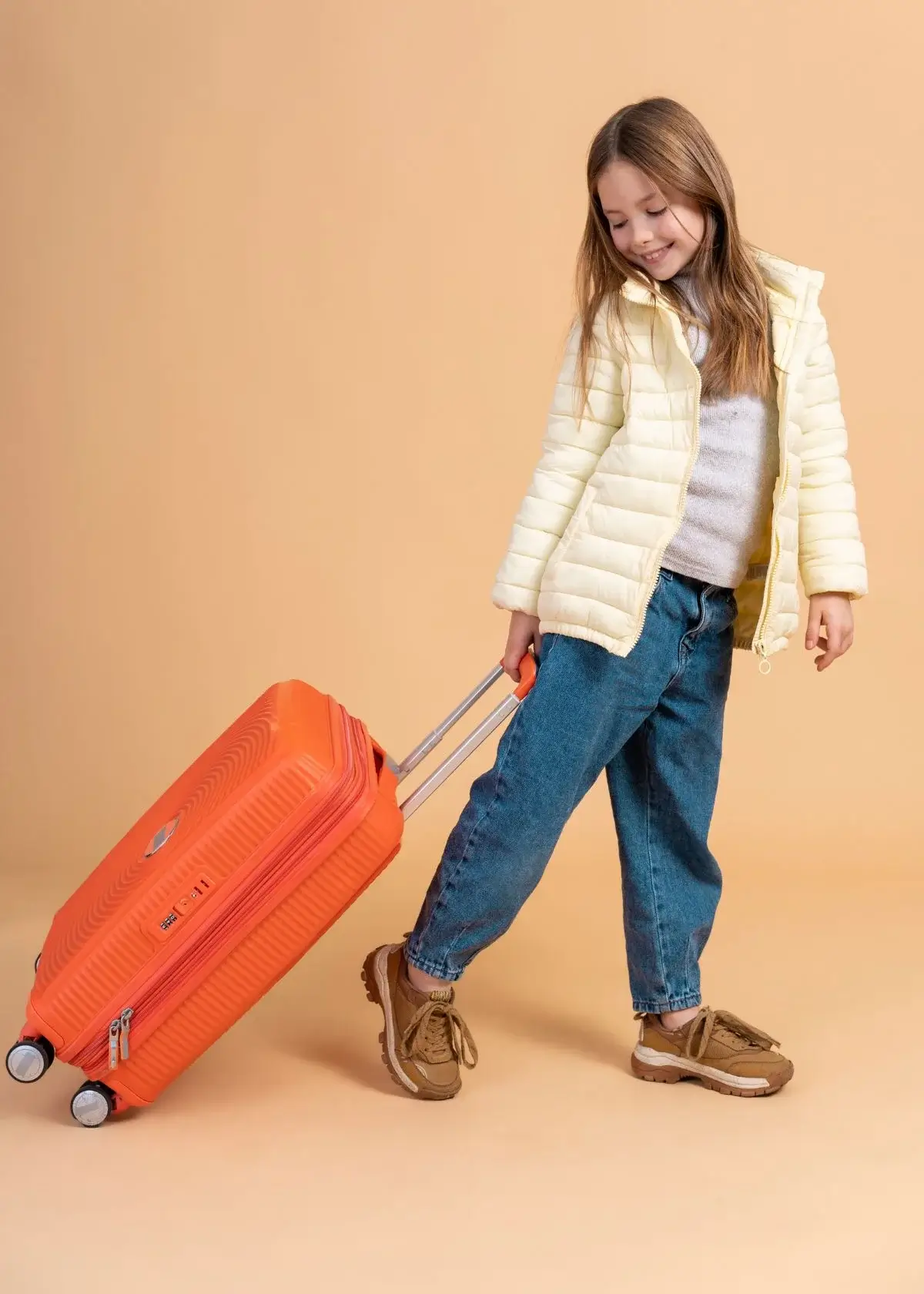 How do I clean and maintain a kids' travel bag?